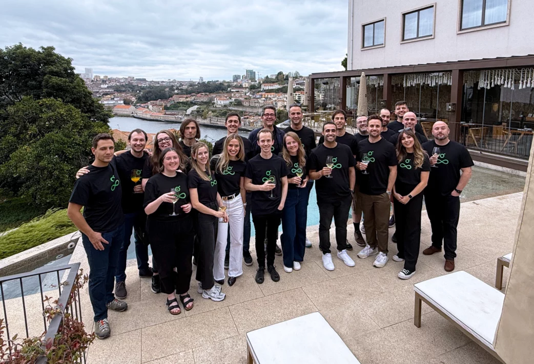 Team Guru gathered in front of a pool in Porto.