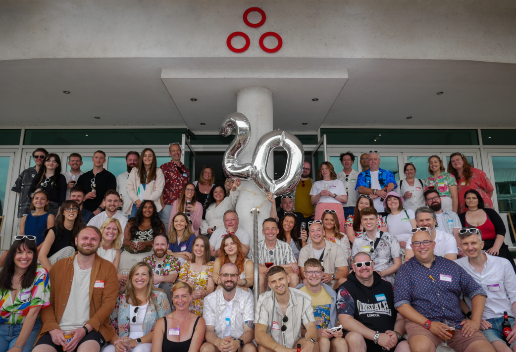 Spindogs team group photo from the agency's 20th anniversary for Resource Guru customer success story.