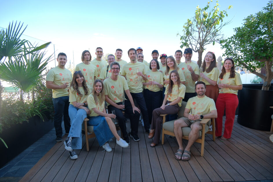 Group shot of the Resource Guru team on a rooftop in Madrid.